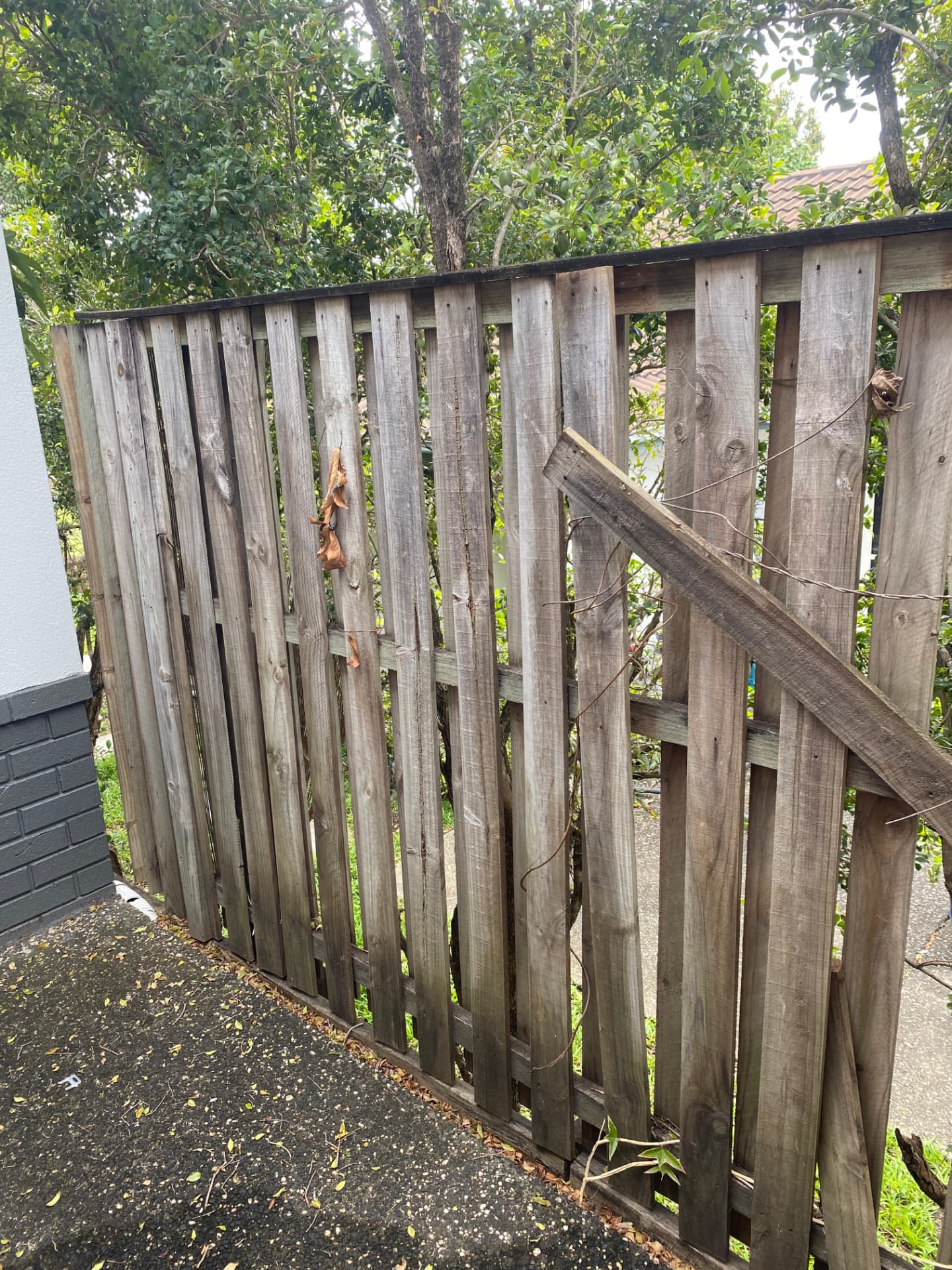 Old weathered timber fence before replacement